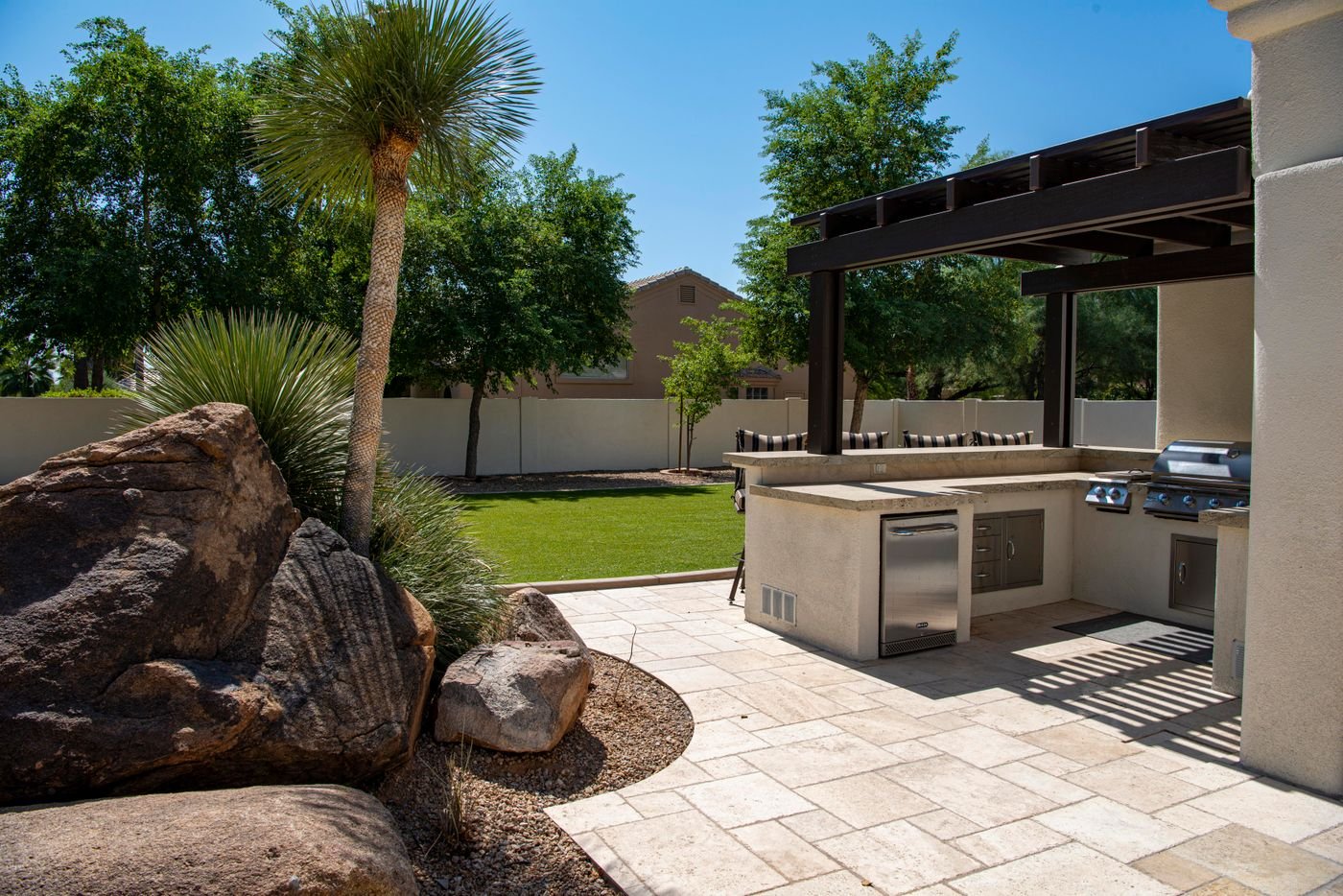Outdoor paver patio beside a Florida home